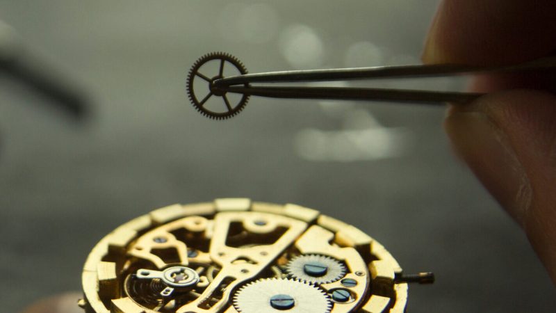 Watchmaker rapairs a mechanical watches